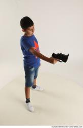 TIMBO STANDING POSE WITH GUN